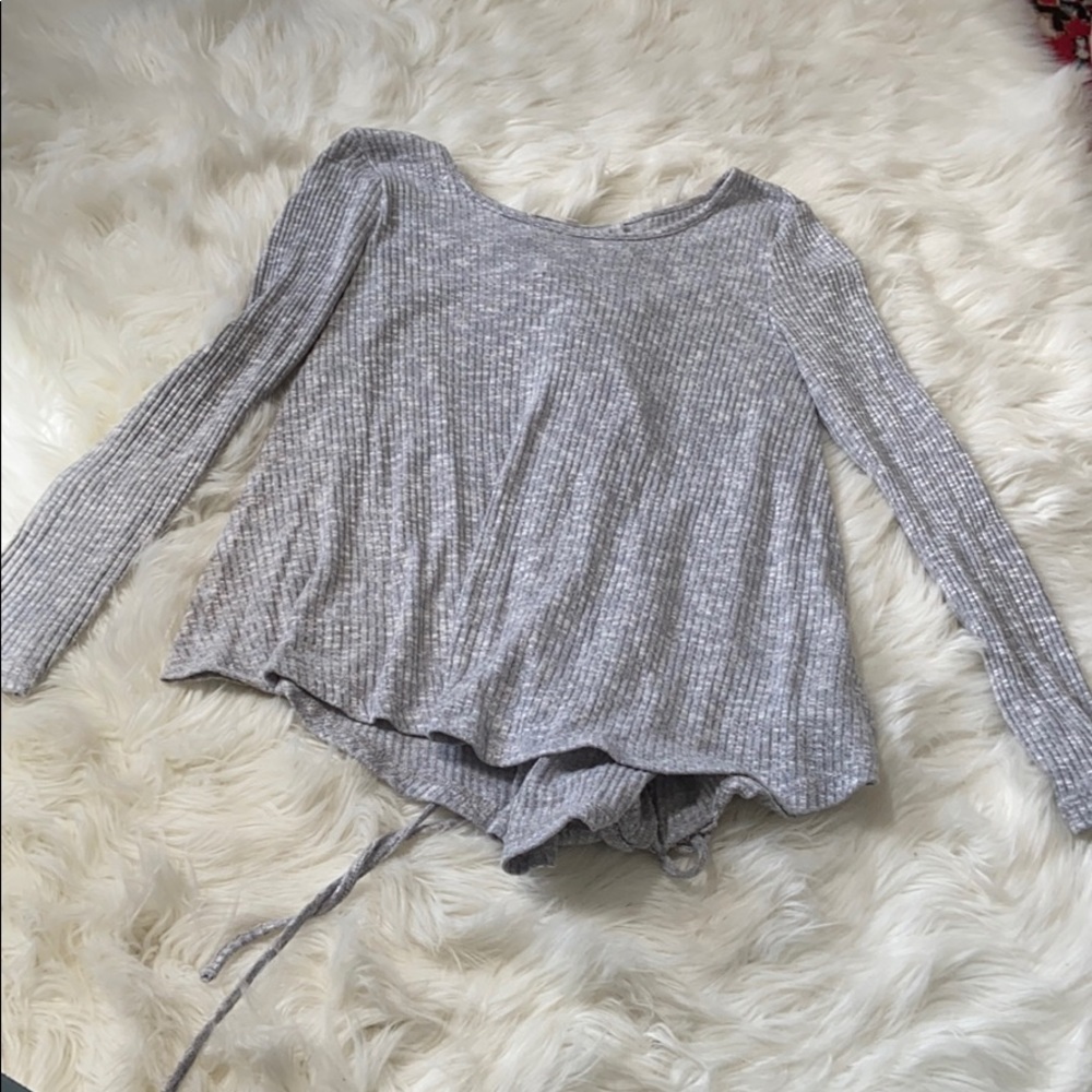 Grey sweater top with tie detail on the back